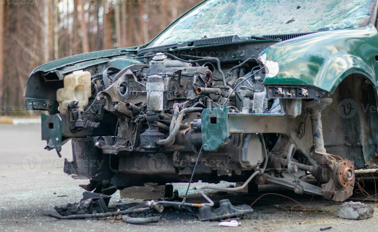 Broken crumpled car after a severe accident with a skewed body, after a powerful impact on the side of the road. Traffic accident on the street, damaged car after a collision in the city. photo