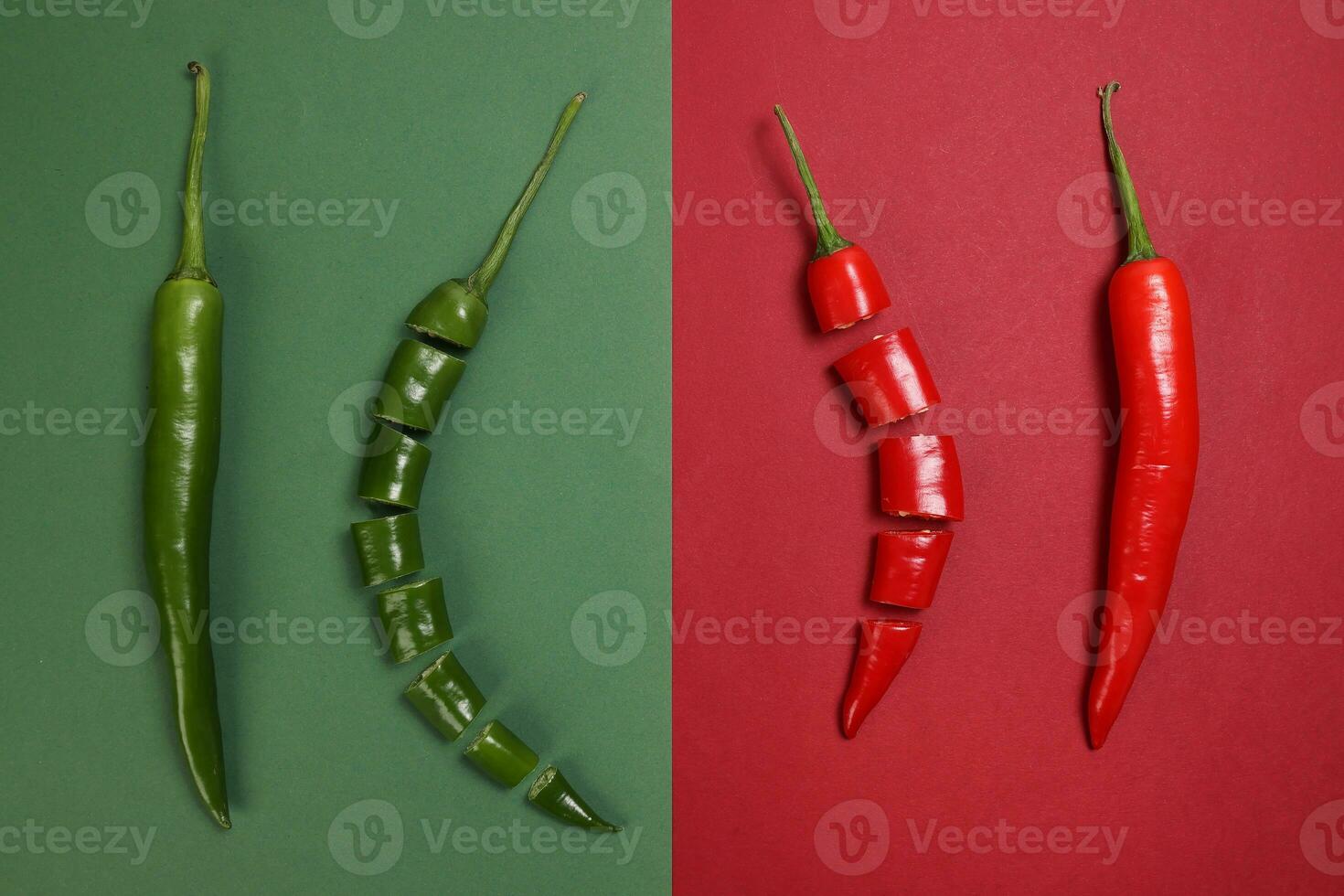 whole green red chilli pepper on green red paper background cut pieces seeds photo