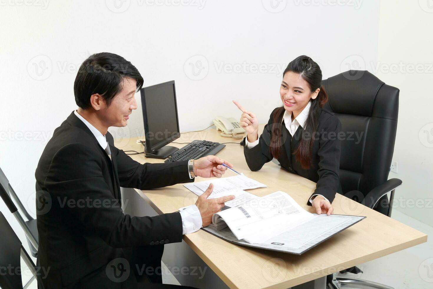 Young Asian man woman wearing business office suit chair table computer white background photo