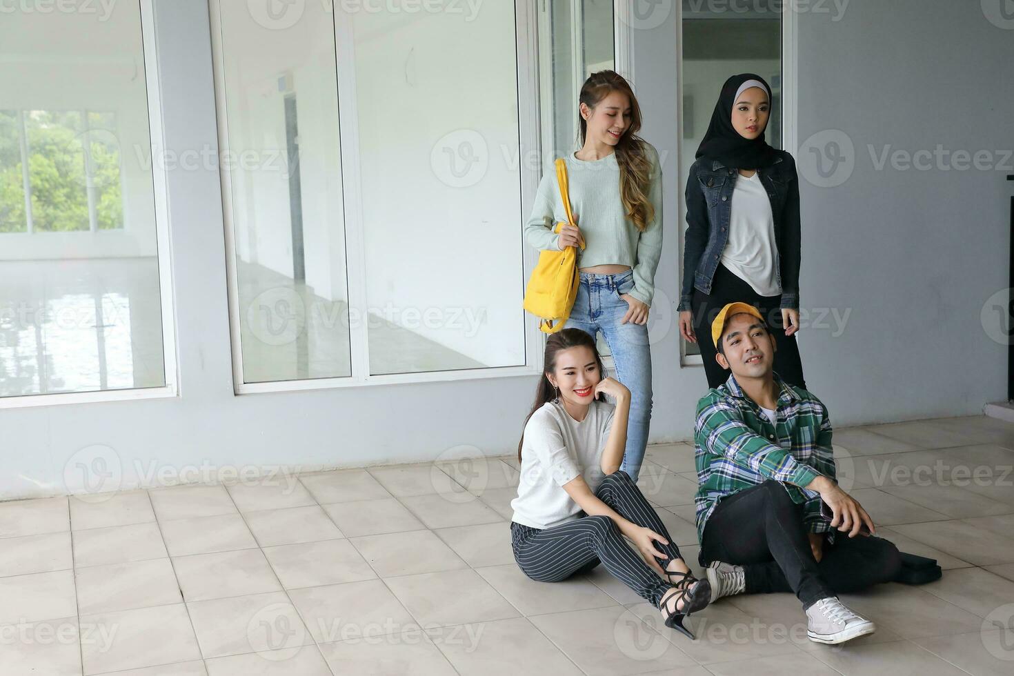Young asian malay chinese man woman indoor stair corridor campus book file folder laptop computer phone sit stand study mingle photo