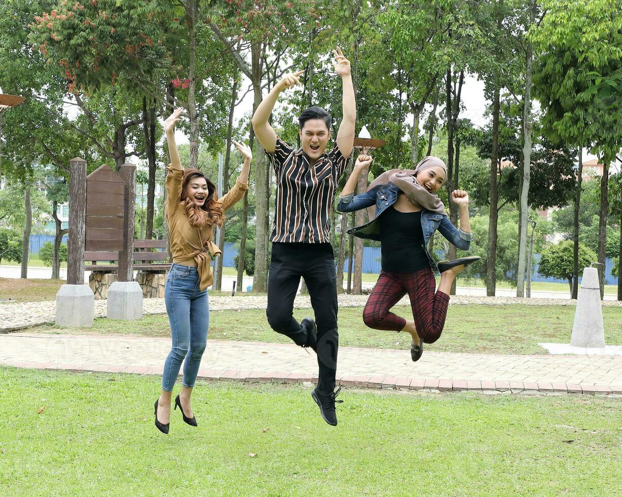 Young Asian different ethnic malay chinse  man woman activity lifestyle student educating job business jump in air photo