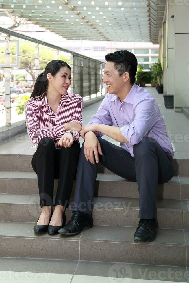 Young south east Asian middle eastern man woman business colleague outdoor stand pose photo