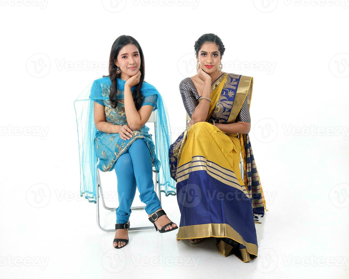 Two South east Asian Indian race ethnic origin woman wearing Indian dress costume sharee and salwar kameez multiracial community on white background photo