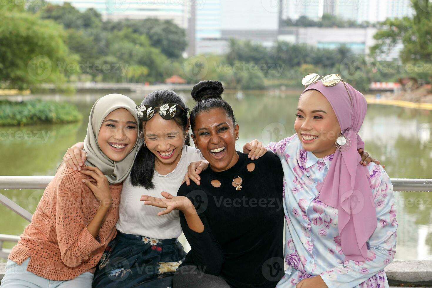 Group of woman Malay Chinese Indian Asian outdoor green park lake nature happy laugh smile mingle photo