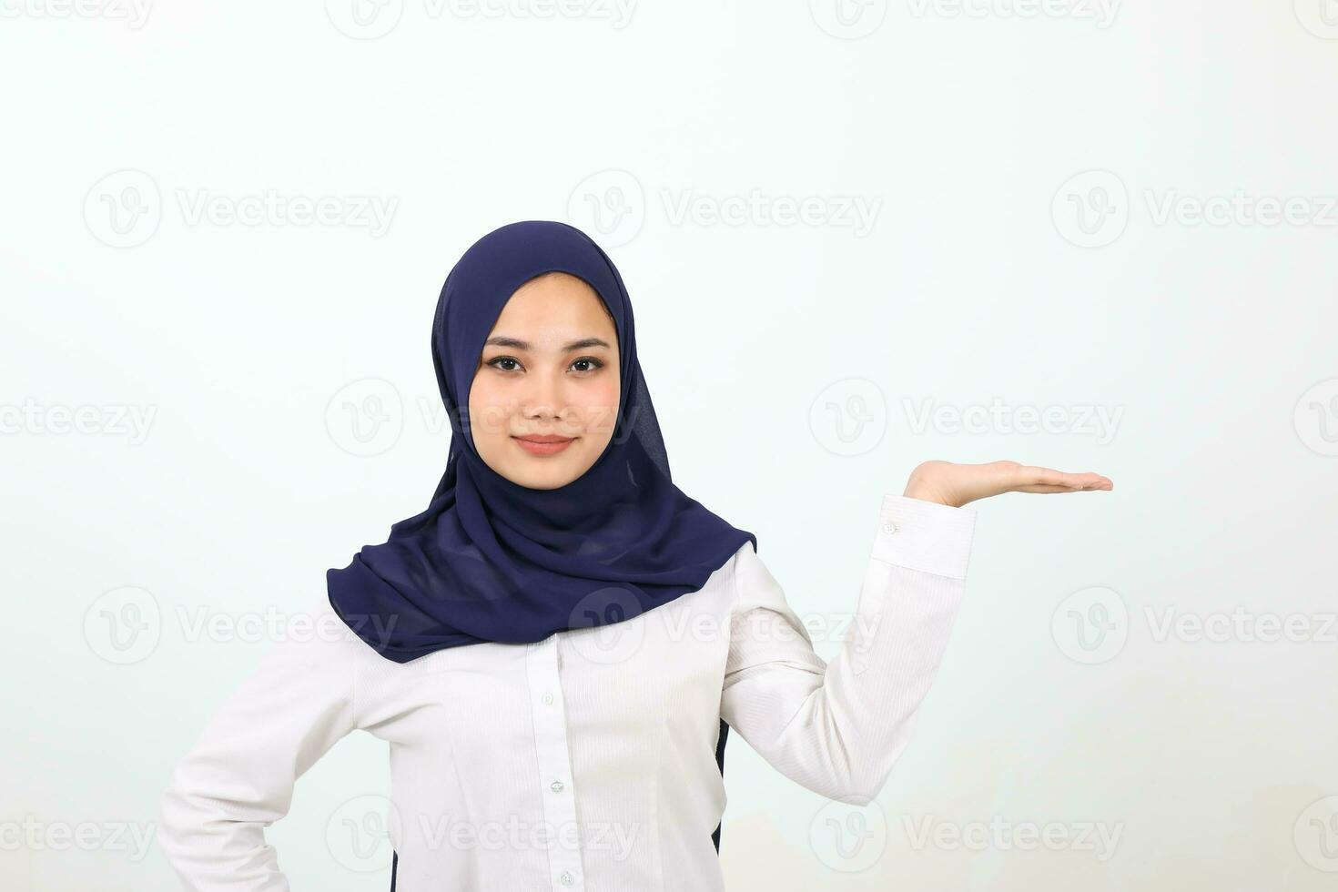 South east Asian Malay Woman headscarf facial expression show point palm of hand photo