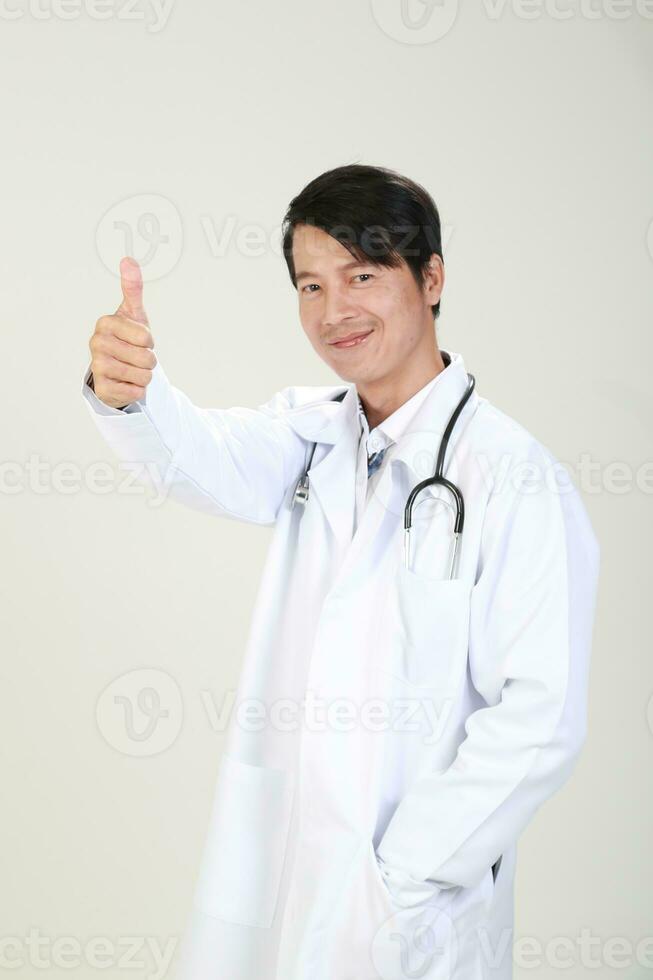 Young Asian male doctor wearing apron uniform tunic apron hold photo