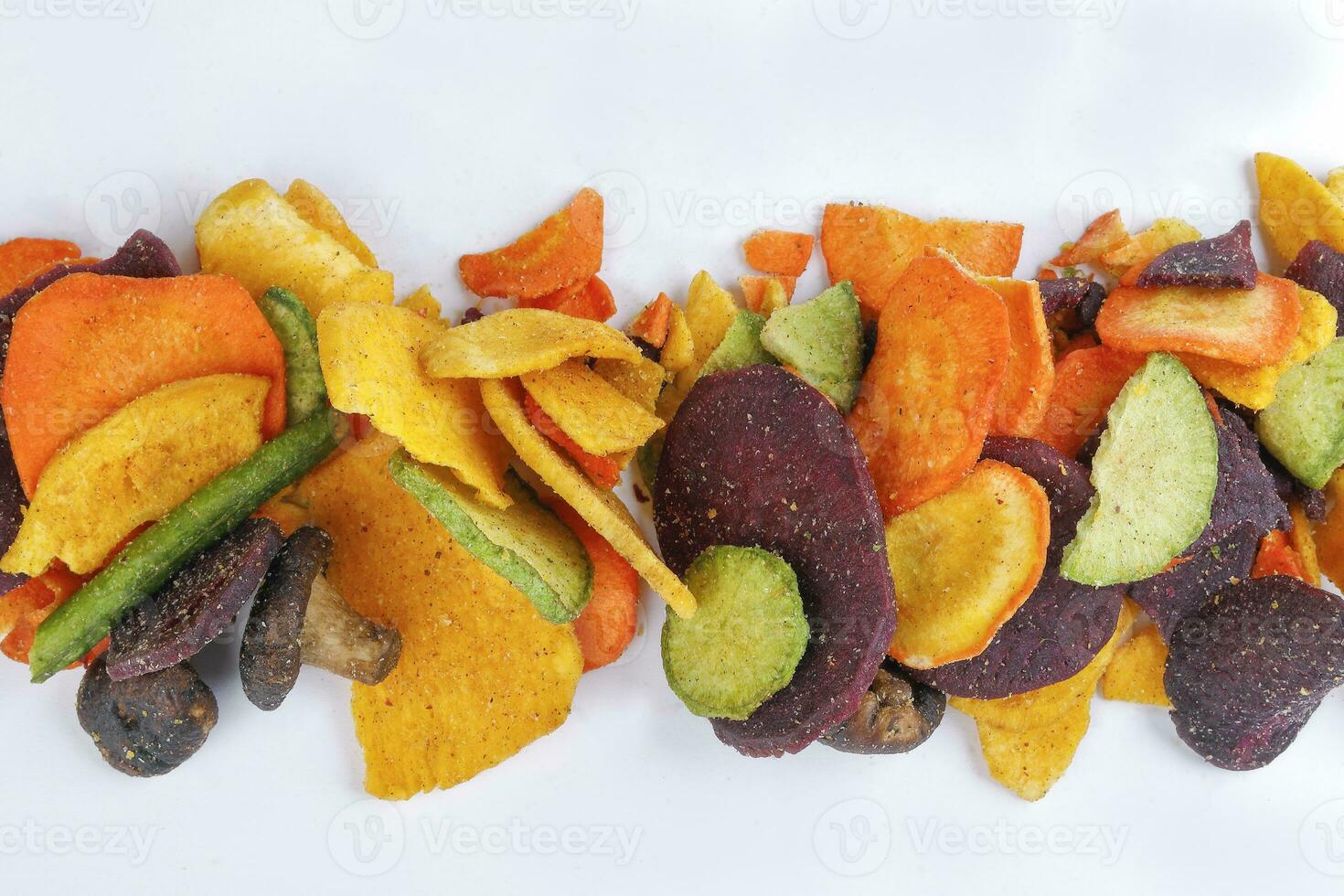 Healthy vegetable chips yellow sweet potato purple sweet potato carrot green radish green beans and shiitake mushrooms photo