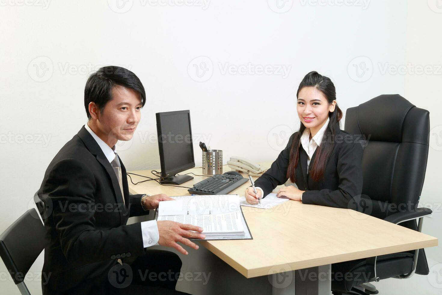 Young Asian man woman wearing business office suit chair table computer white background photo