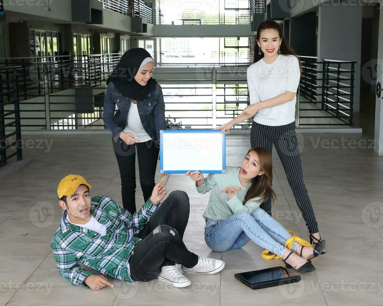 Young asian malay chinese man woman indoor stair corridor campus book file folder laptop computer phone sit stand study mingle photo
