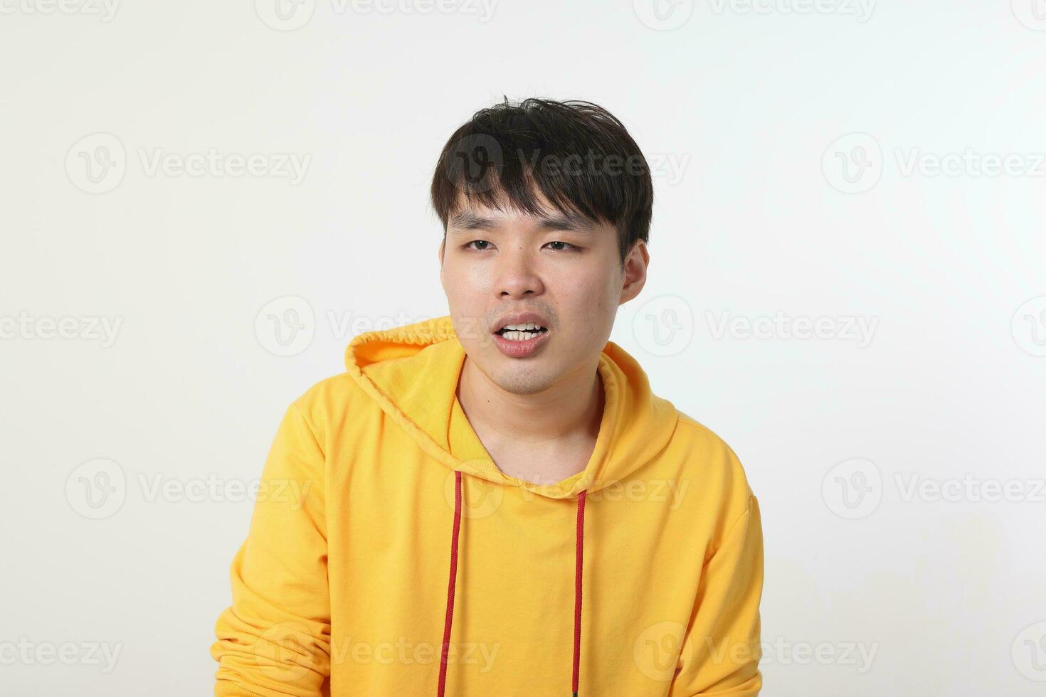 Young good looking Asian chinese malay man pose face body expression mode emotion on white background what huh strange shocked look photo