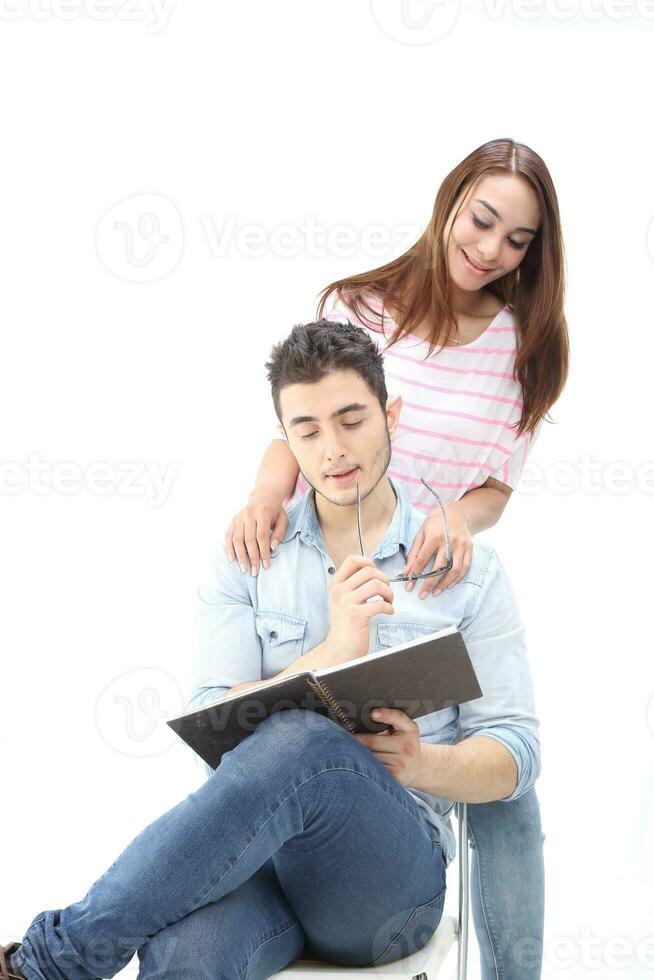 Yong south east Asian middle eastern Caucasian youth man woman in casual dress walk talk fun sit at table book notebook pen laptop computer study think read on white background photo