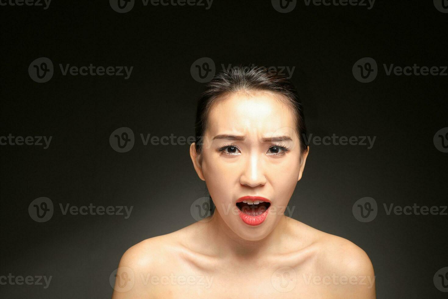 Young beautiful Asian woman facial expression photo