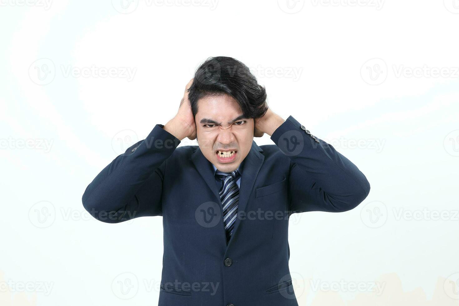 South east Asian Malay Man facial expression angry upset shocked angry hand on head ear look front at camera photo