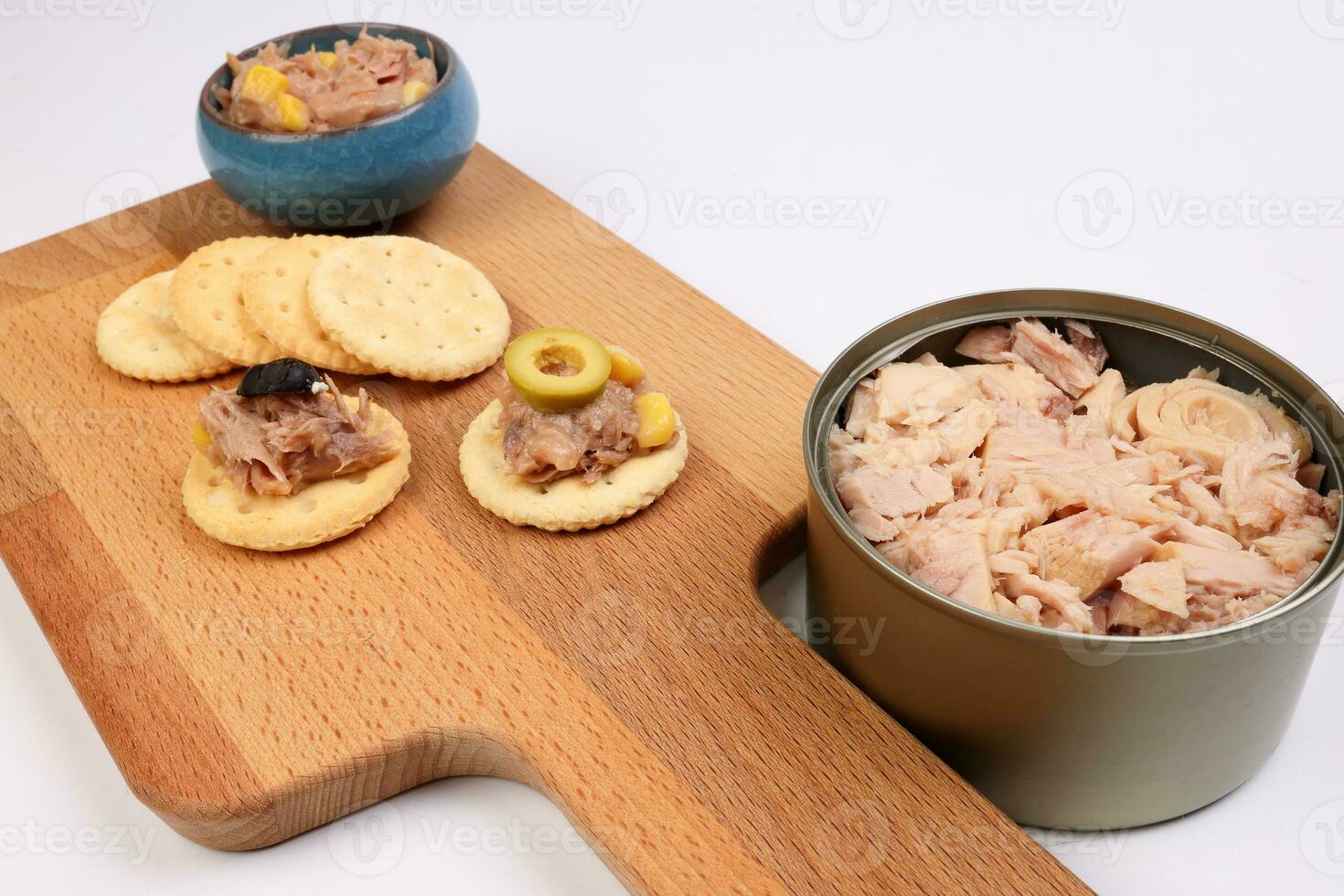 Tuna fish spread topping cracker biscuit tapas corn green black olive