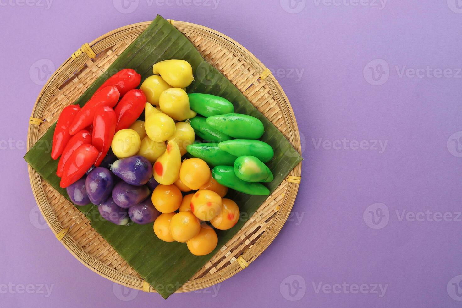 Colourful Luk chup look choop tadeonal Thai desert sweets candy creatve variety bamboo plate banana leaf photo