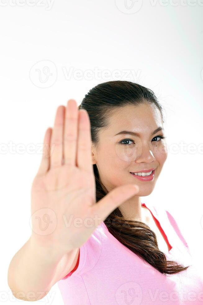 beautiful young south east Asian Chinese woman hand stop sign on white background photo