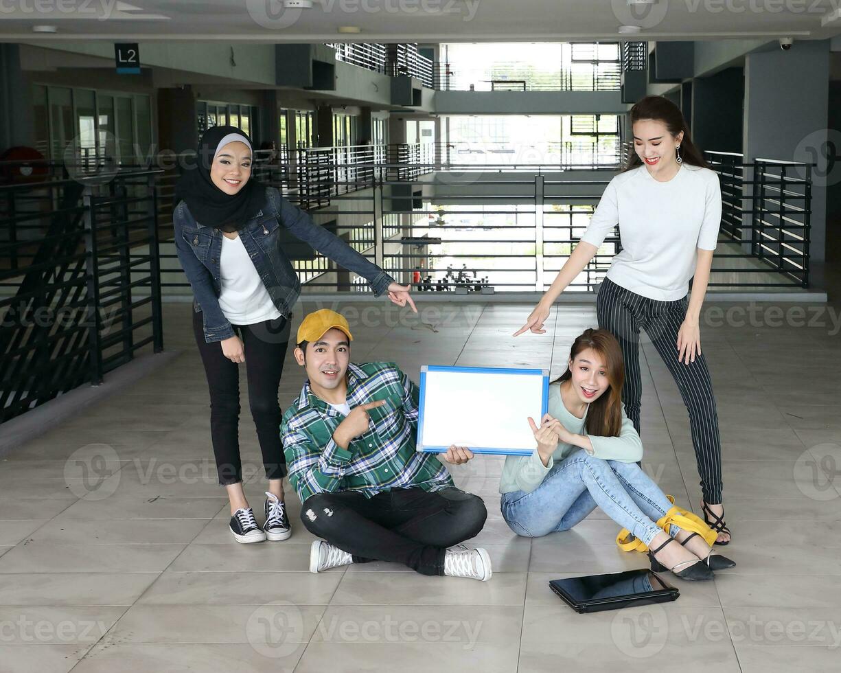 Young asian malay chinese man woman indoor stair corridor campus book file folder laptop computer phone sit stand study mingle copy text space whiteboard point show photo