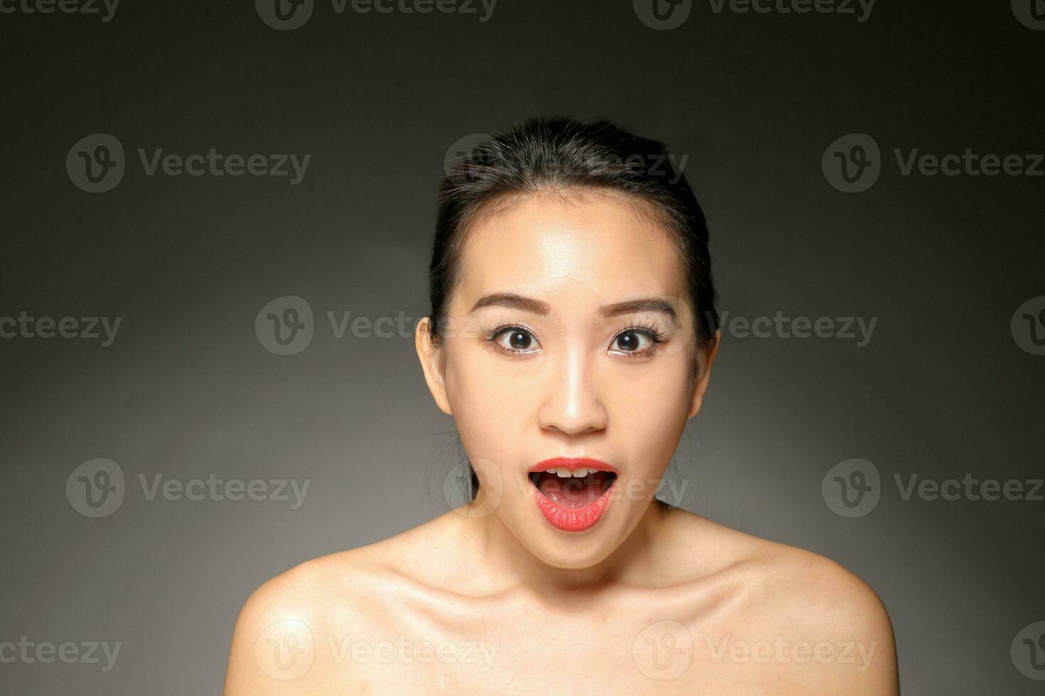 Young beautiful Asian woman facial expression photo