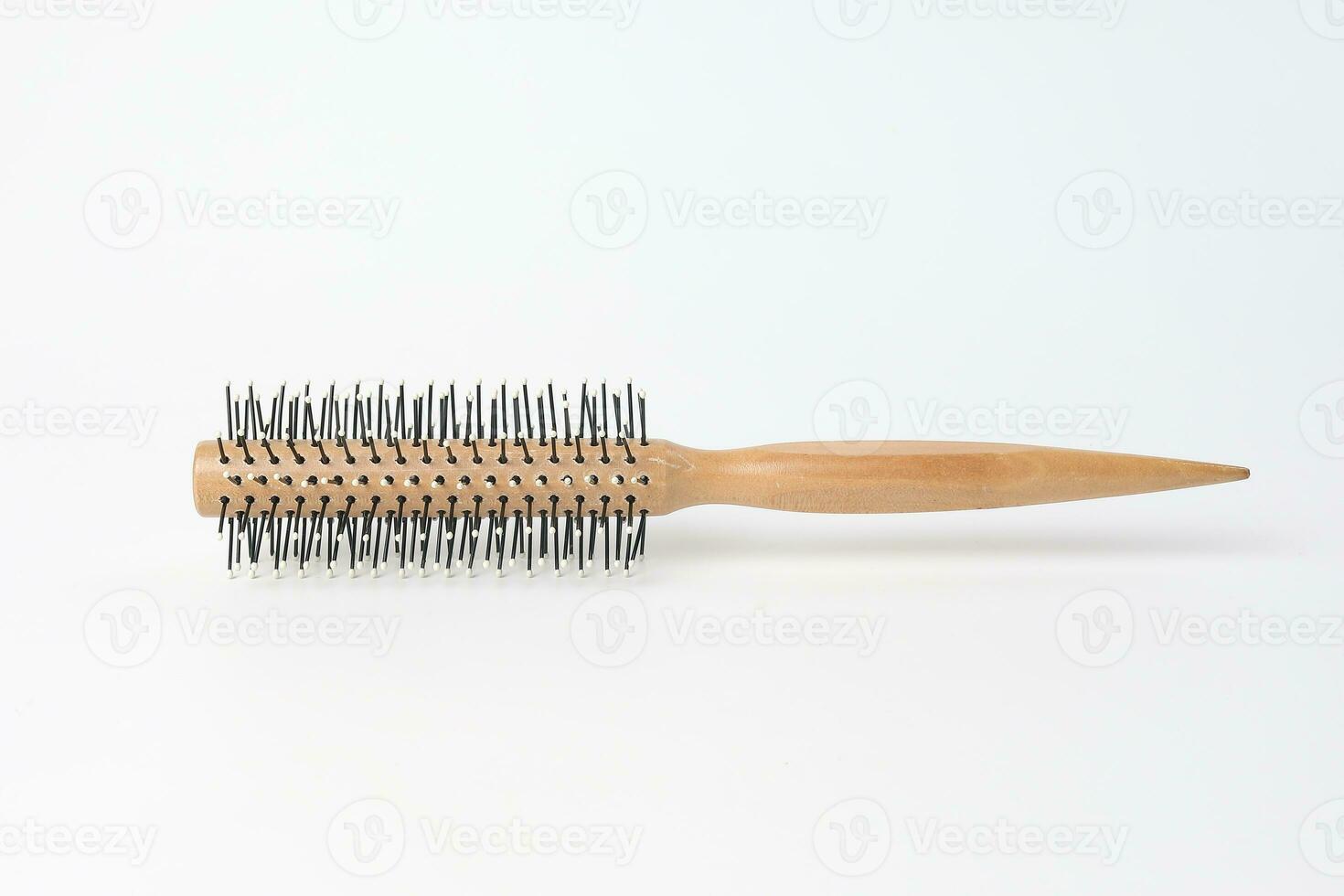 Round hair brush comb on white background photo