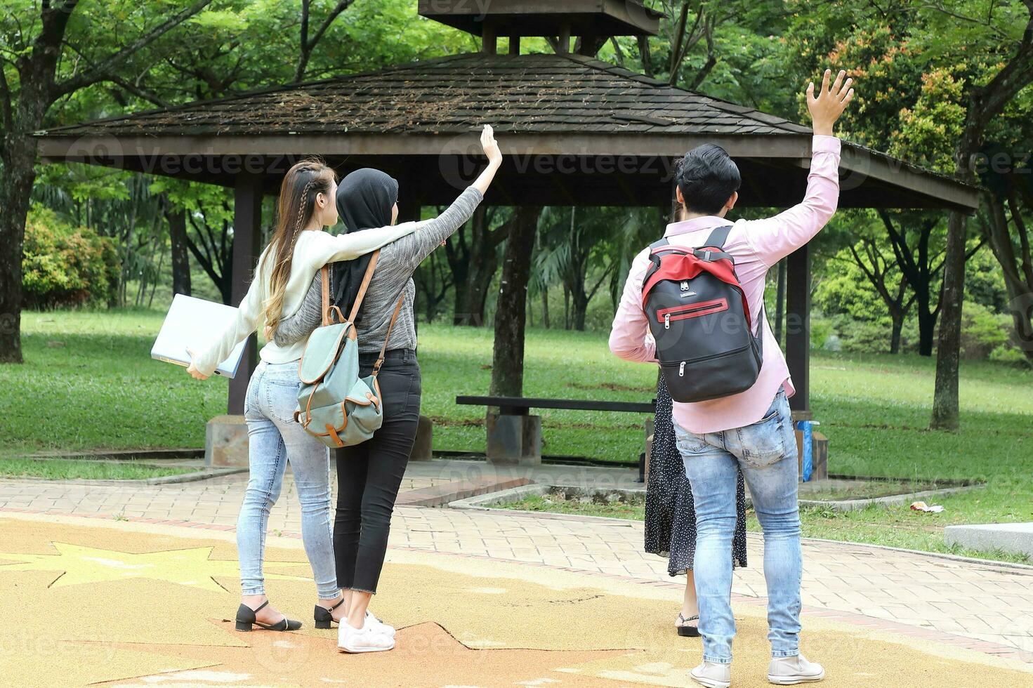 Young asian malay chinese man woman outdoor park  book file folder laptop computer phone sit stand study mingle photo