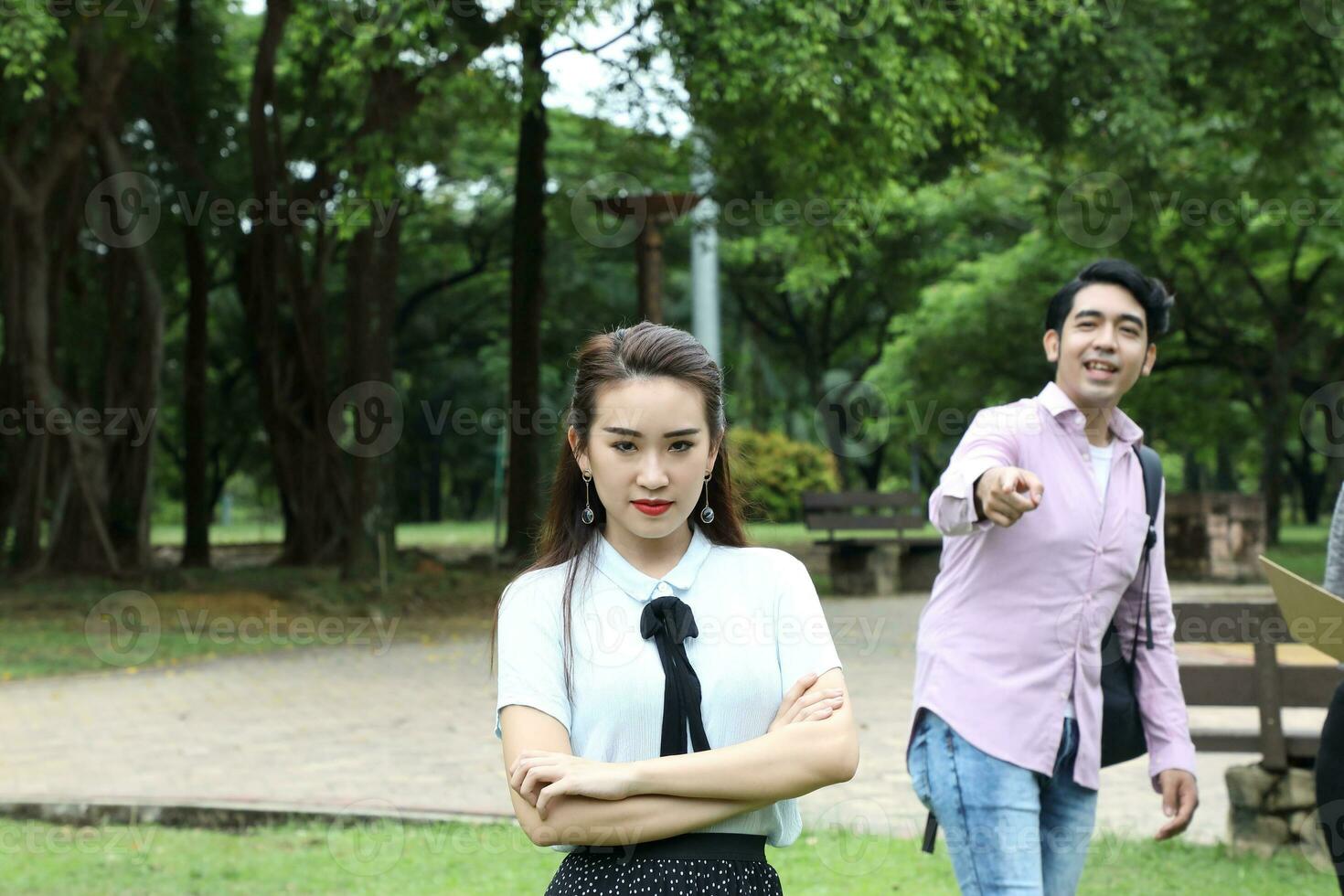 Young asian malay chinese man woman outdoor park  book file folder laptop computer phone sit stand study mingle photo