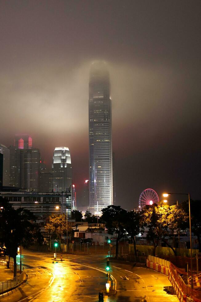 Hong Kong, Central-January 26, 2020  The Hong Kong International Finance Center in cloudy weather. The roads are empty for new year holiday and fear of Novel coronavirus, 2019-nCoV, COVID-19. photo