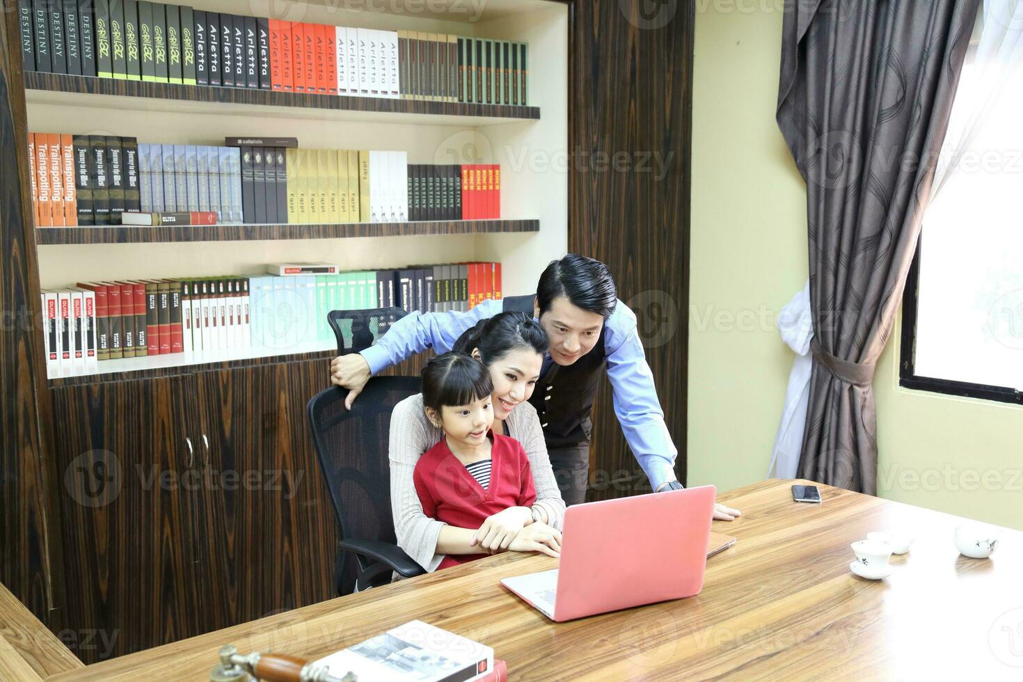 South East Asian young father mother daughter  parent girl child activity indoor photo