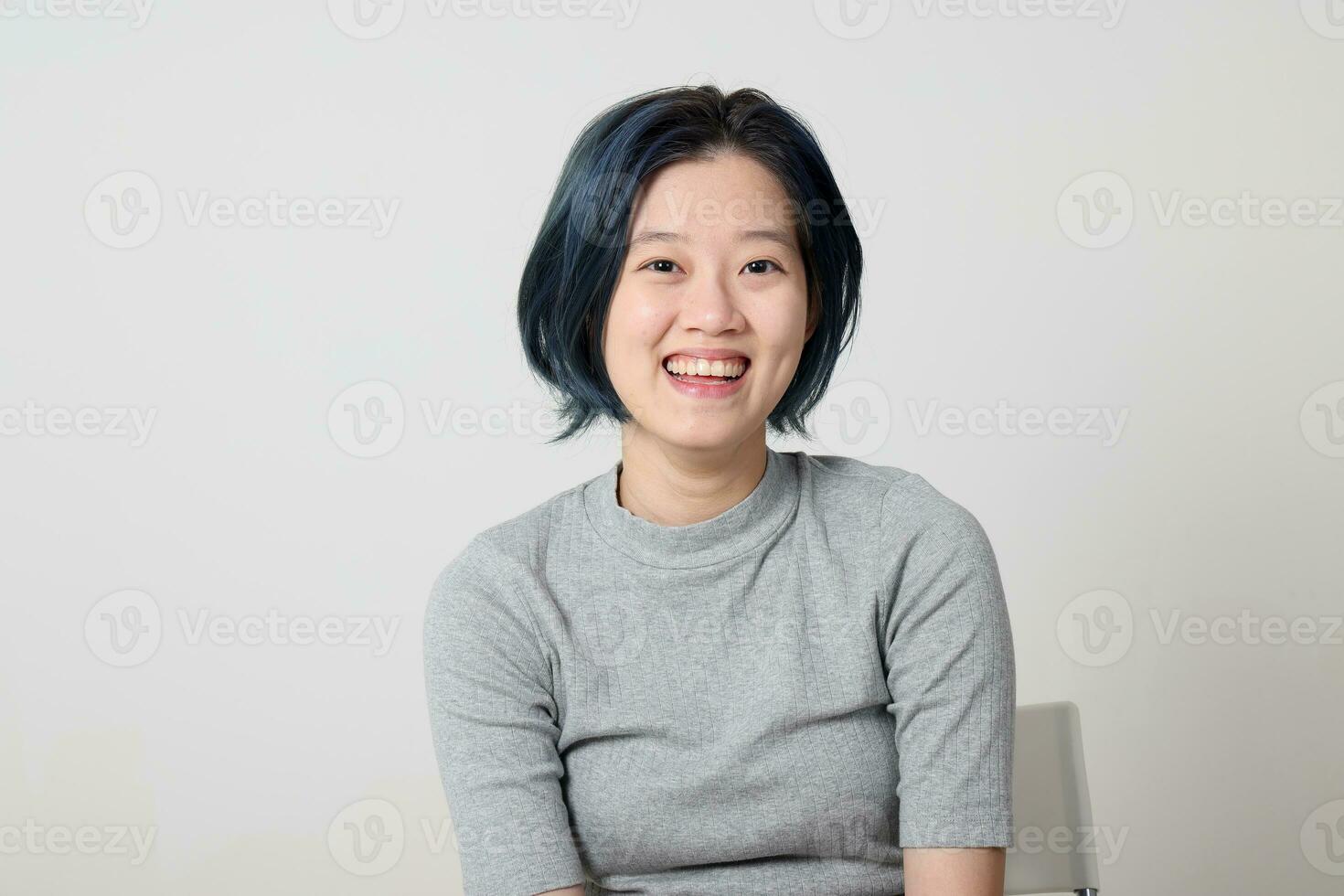 Young attractive Asian chinese malay woman pose face body expression mode emotion on white background laugh smile happy photo