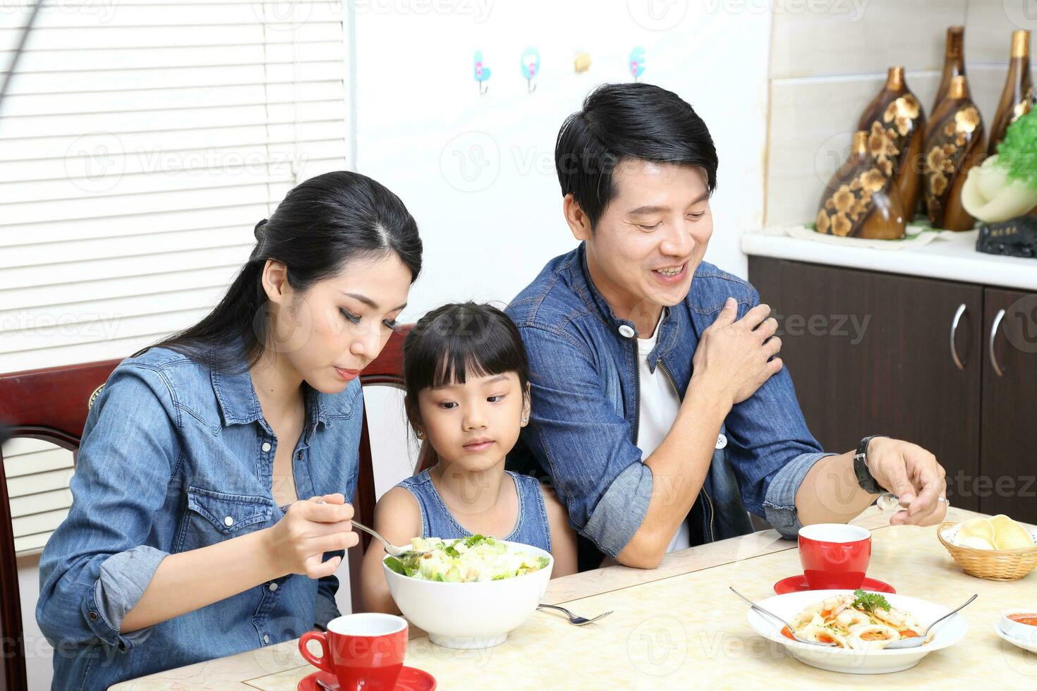 South East Asian young father mother daughter  parent girl child activity indoor photo