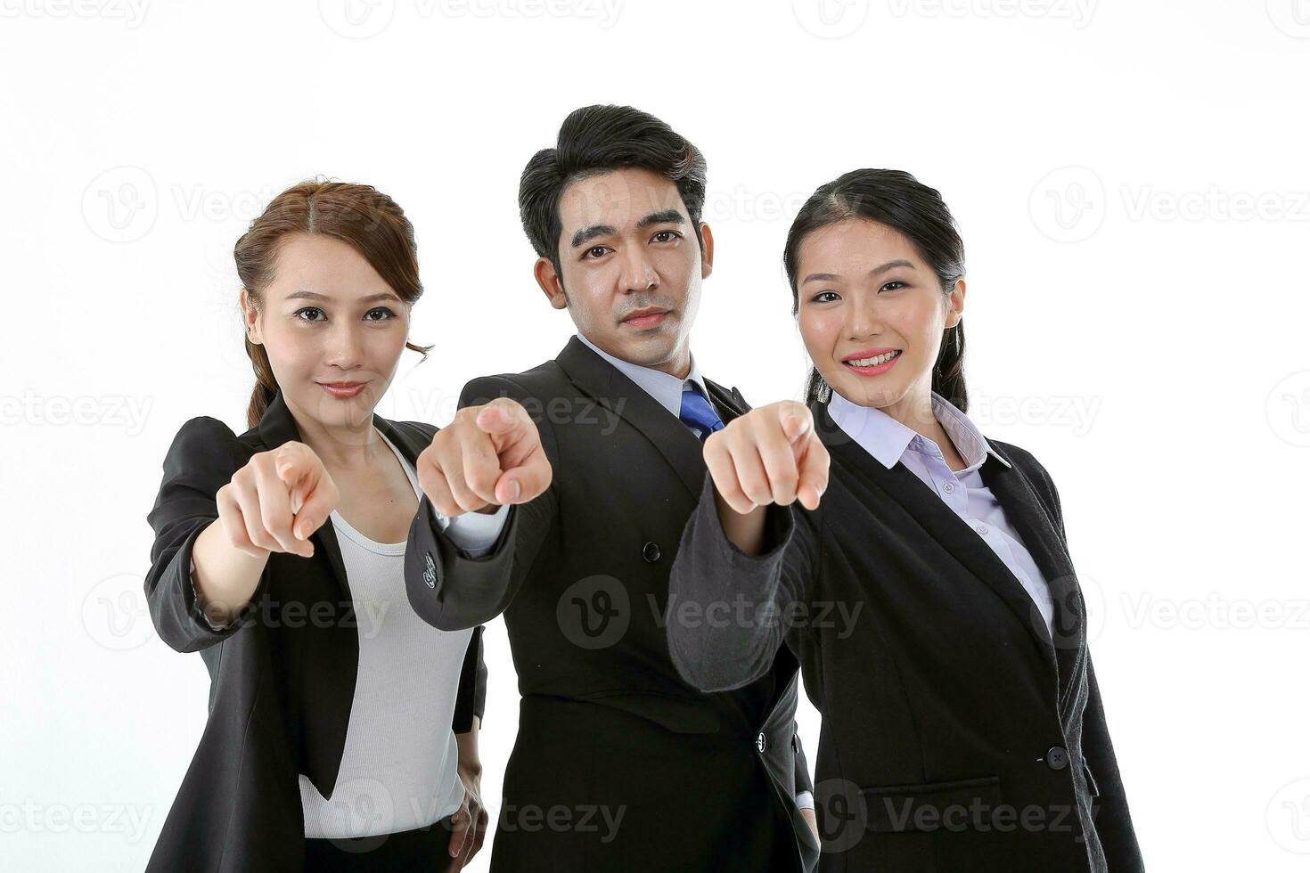 Southeast Asian young office business man woman wearing suit point finger at camera on white studio background photo
