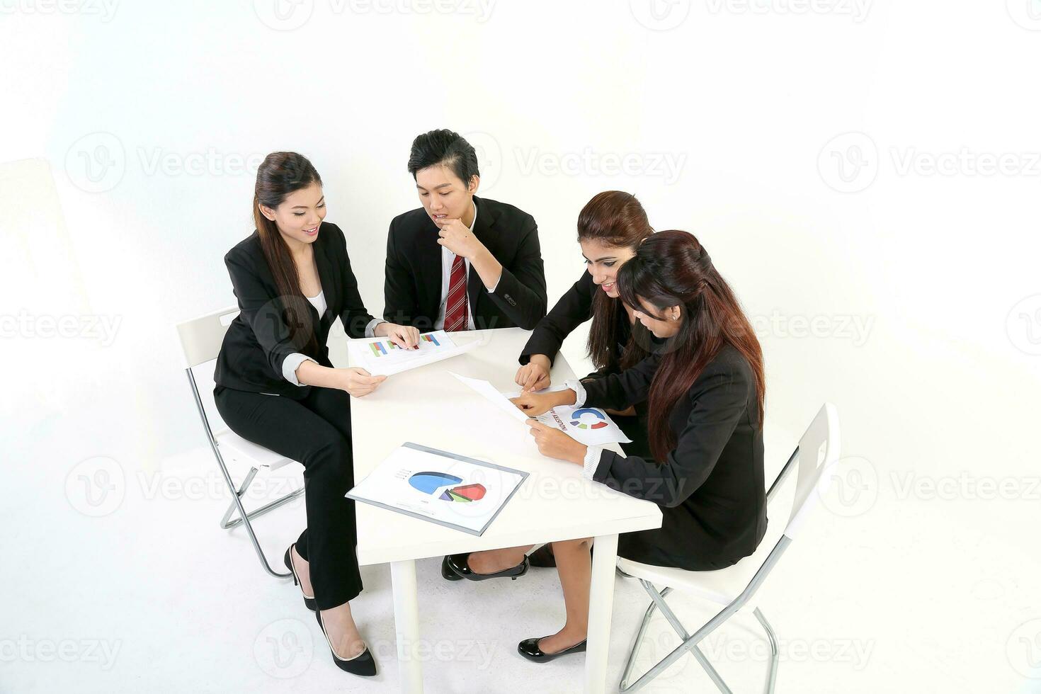 South East Asian young Malay Chinese Indian man woman wearing formal business office ware on white background sit at meeting table talk disuses study file project gruff photo
