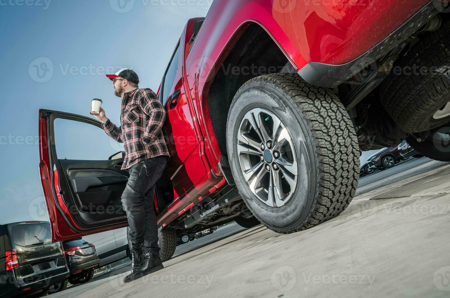 Professional Driver on His Coffee Break at Trucker Rest Stop photo