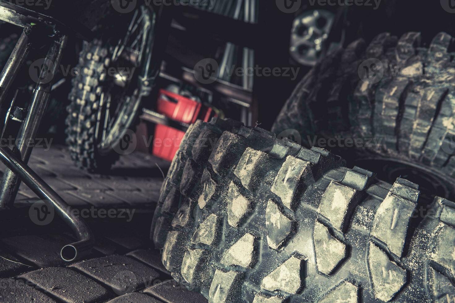 Off Road Vehicle Tires Laying in a Garage photo