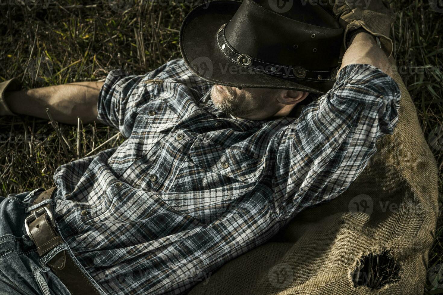 Cowboy man laying down photo
