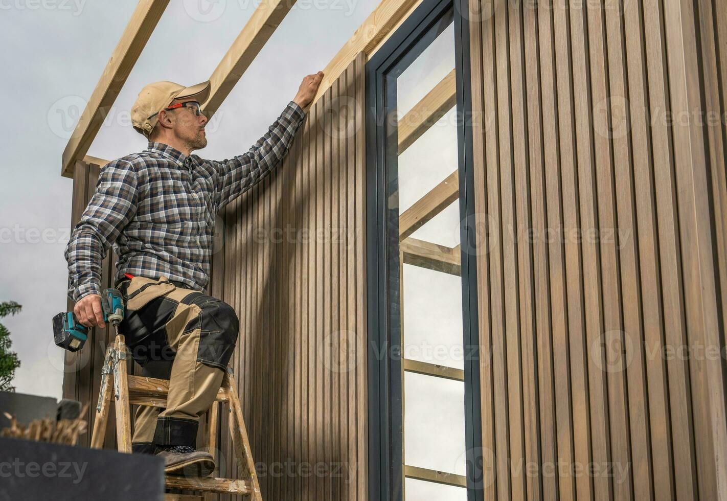 Experienced Woodworker Building Modern Backyard Garden Shed photo