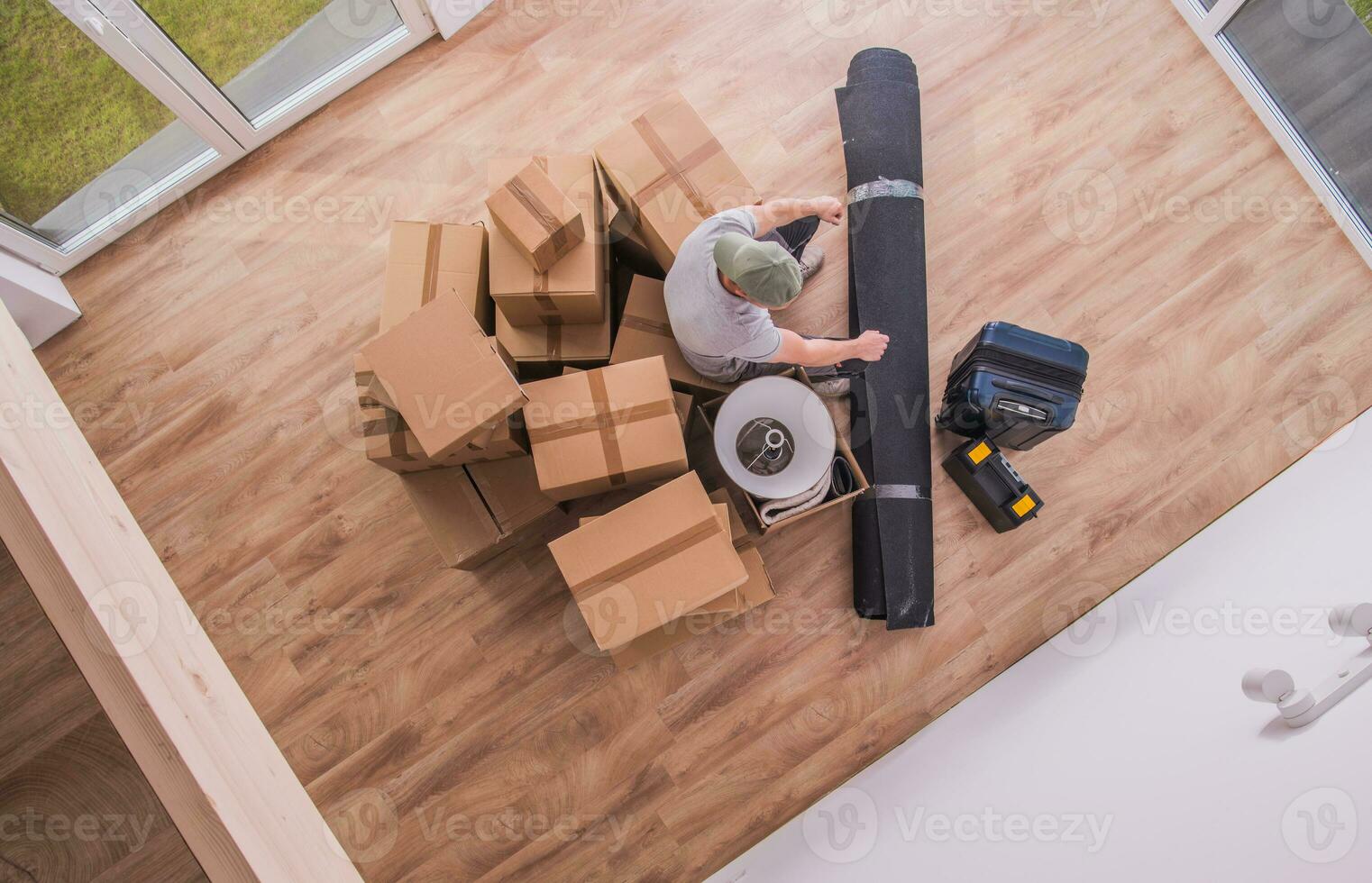 Male Proferssional Mover With Boxes And  Random Hopusehold Pieces. photo