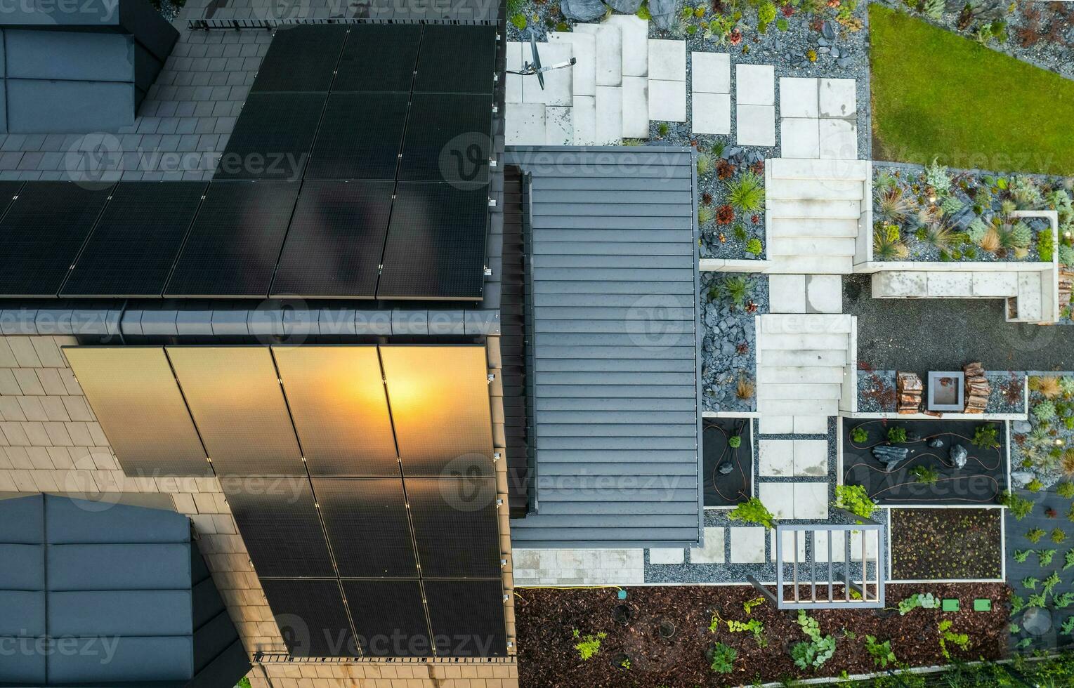 House with Solar Panels and Backyard Garden Aerial photo