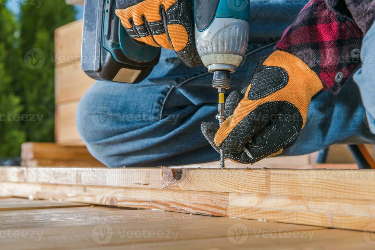 Carpenter Using Drill Driver In Woodworking. photo
