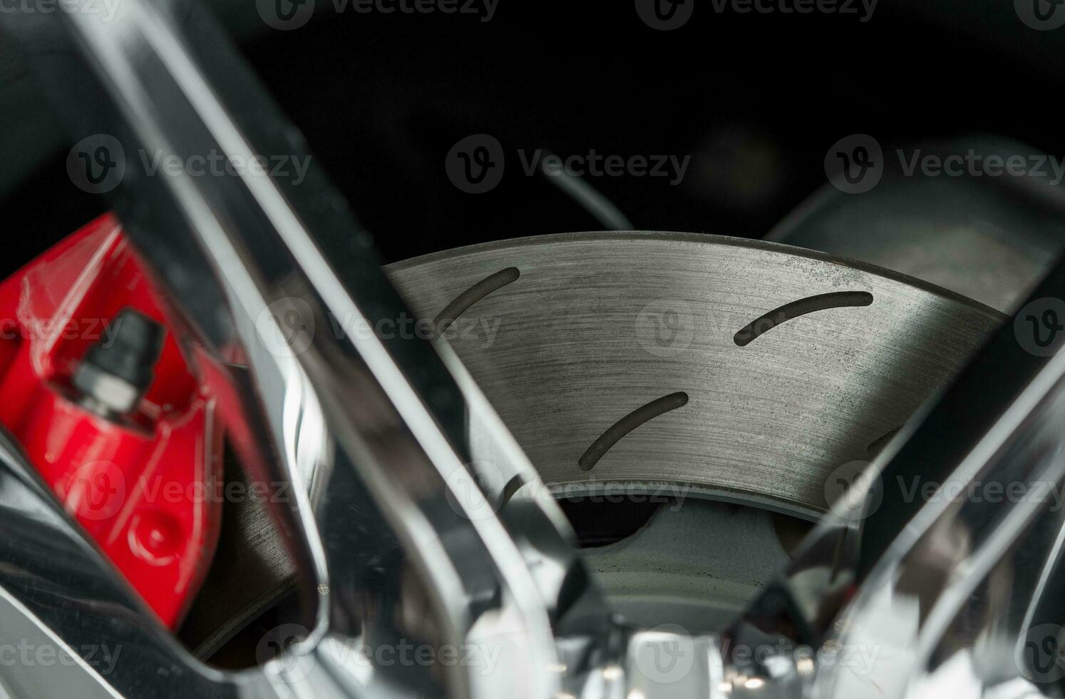 Car Brake Disc with Red Caliper photo