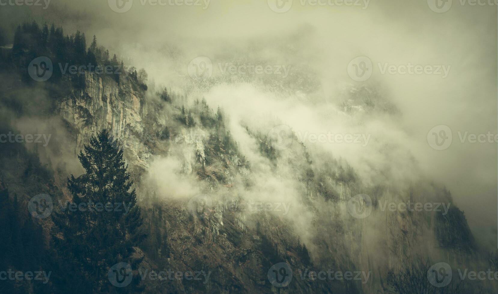 Rocky Mountain Covered with Clouds Landscape photo