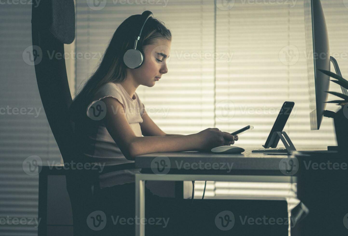 Girl in Front of Smartphone Tablet and Desktop Computer photo