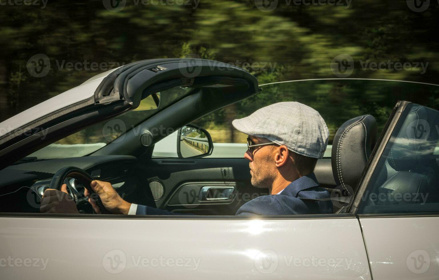 Caucasian Male Driving In Sport Car On Coutry Road. photo