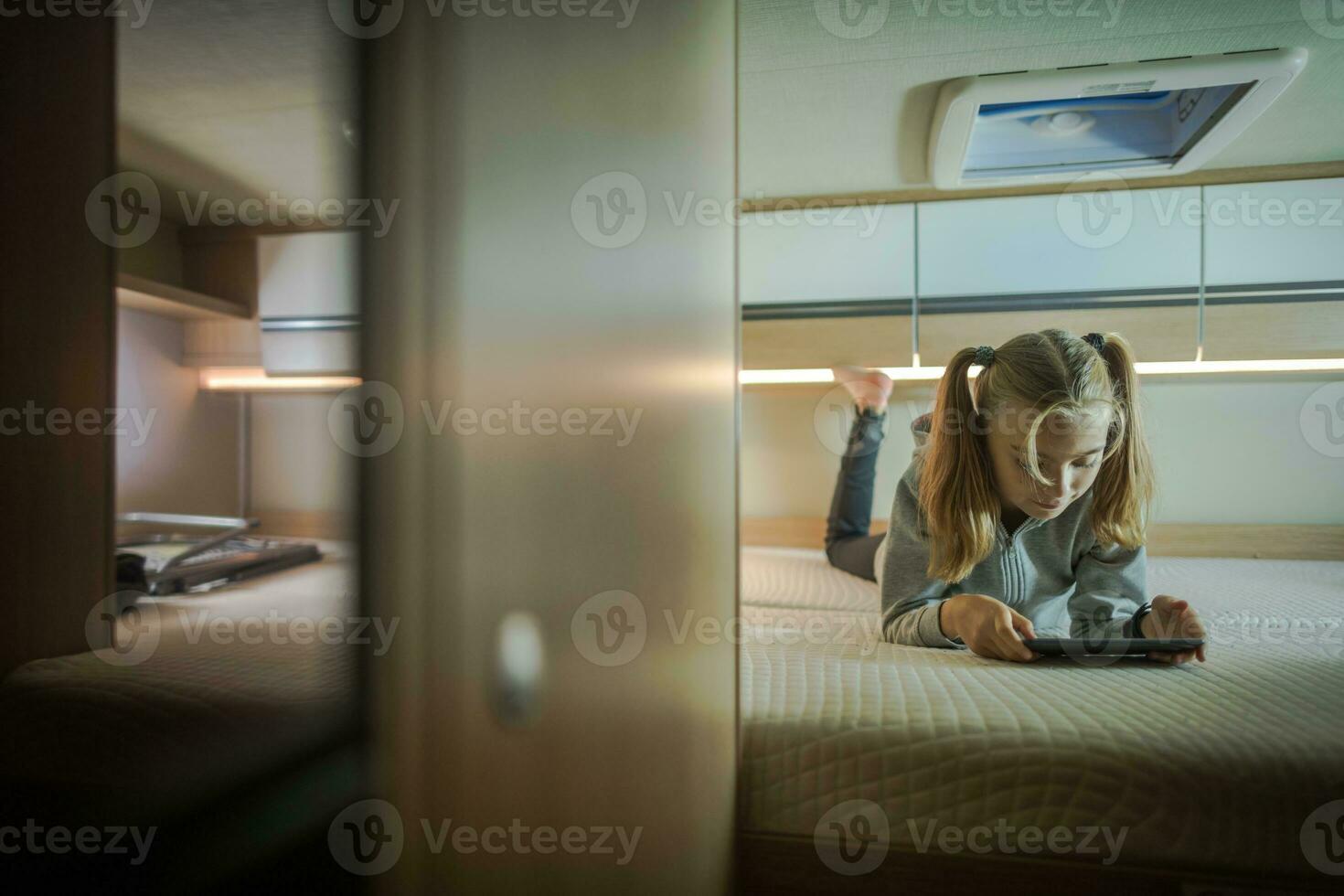Girl Traveling with Tablet photo