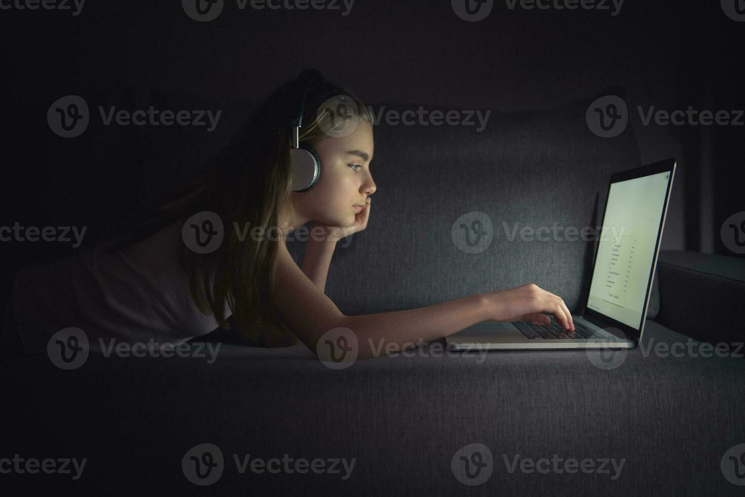 Girl and Her Lazy Time in Front of Laptop Computer photo