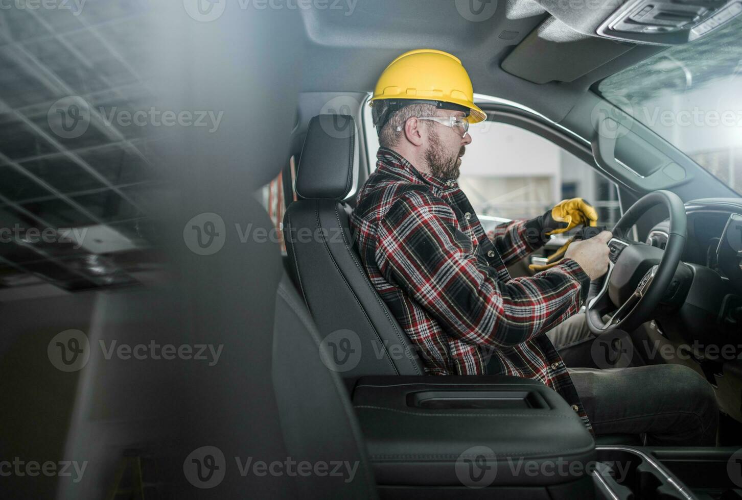 Construction Worker Inside Commercial Pickup Truck photo