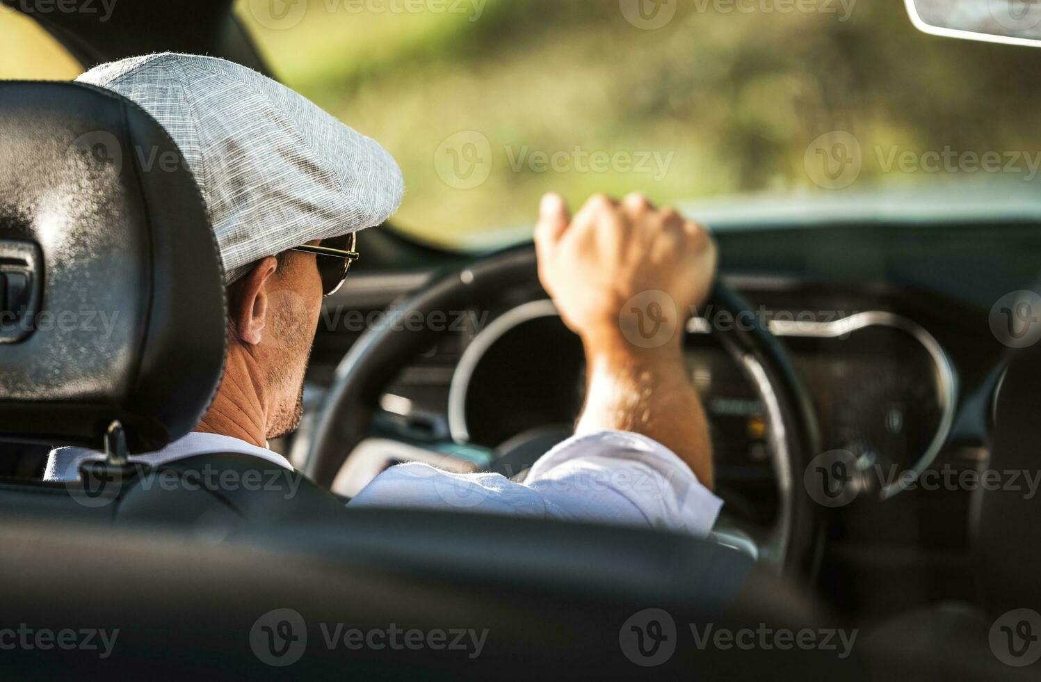 Men Driving Convertible Car photo