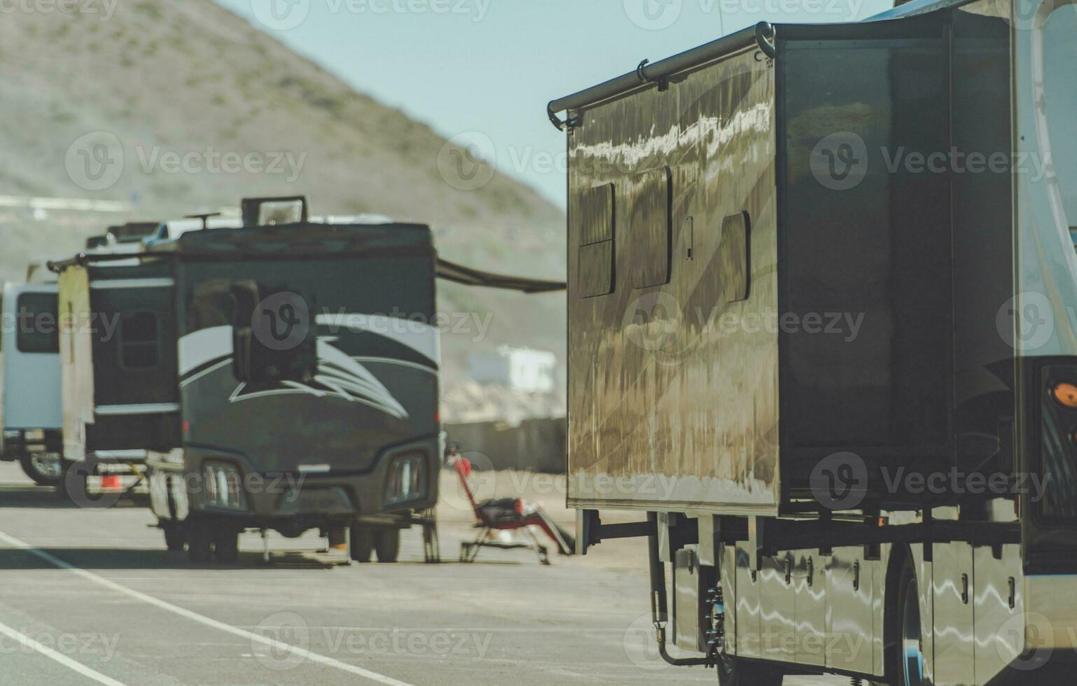 RV Motorhomes Camping Next to California Pacific Shoreline. photo