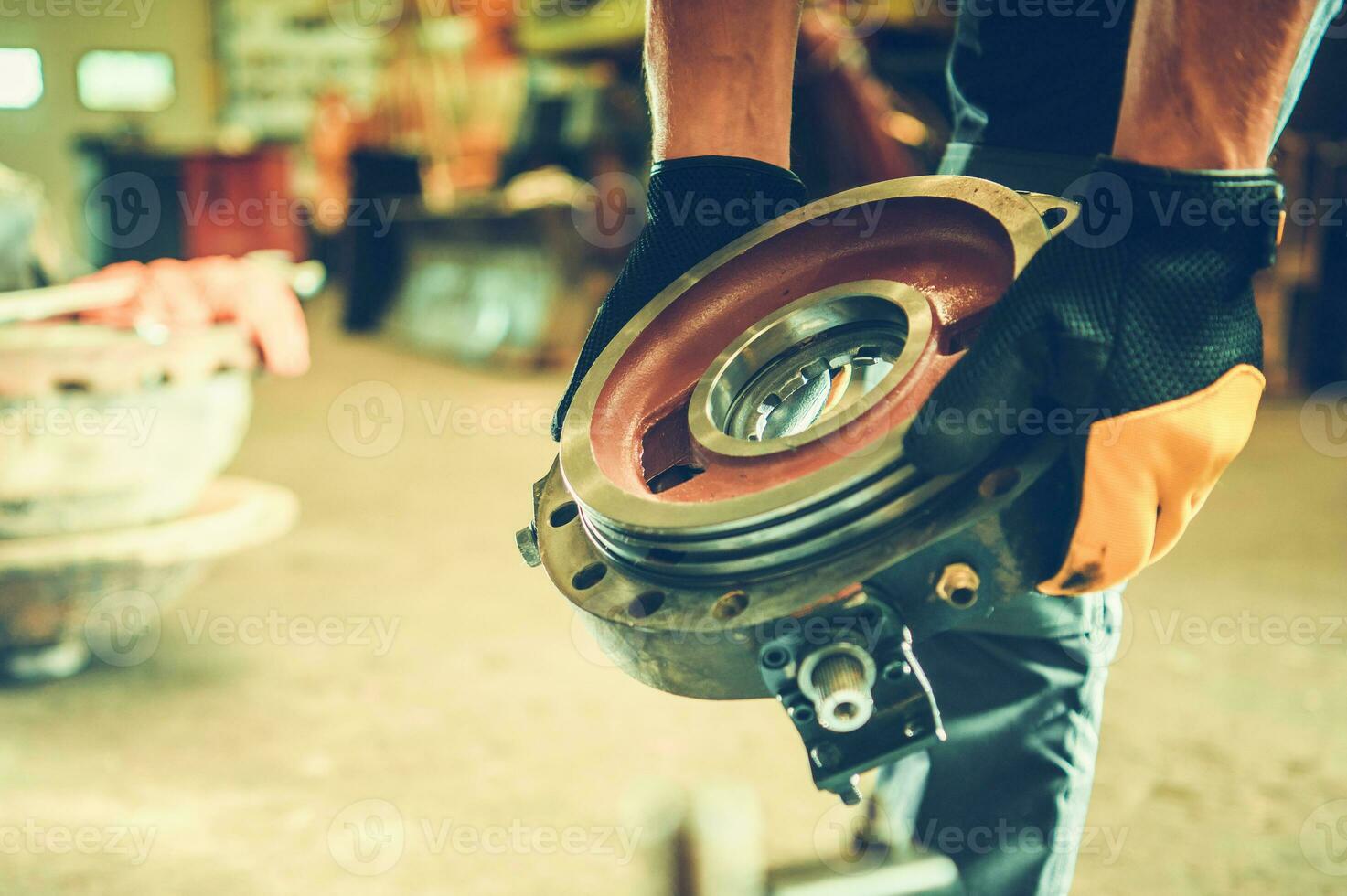 Heavy Equipment Mechanic with a Spare Part in His Hands photo