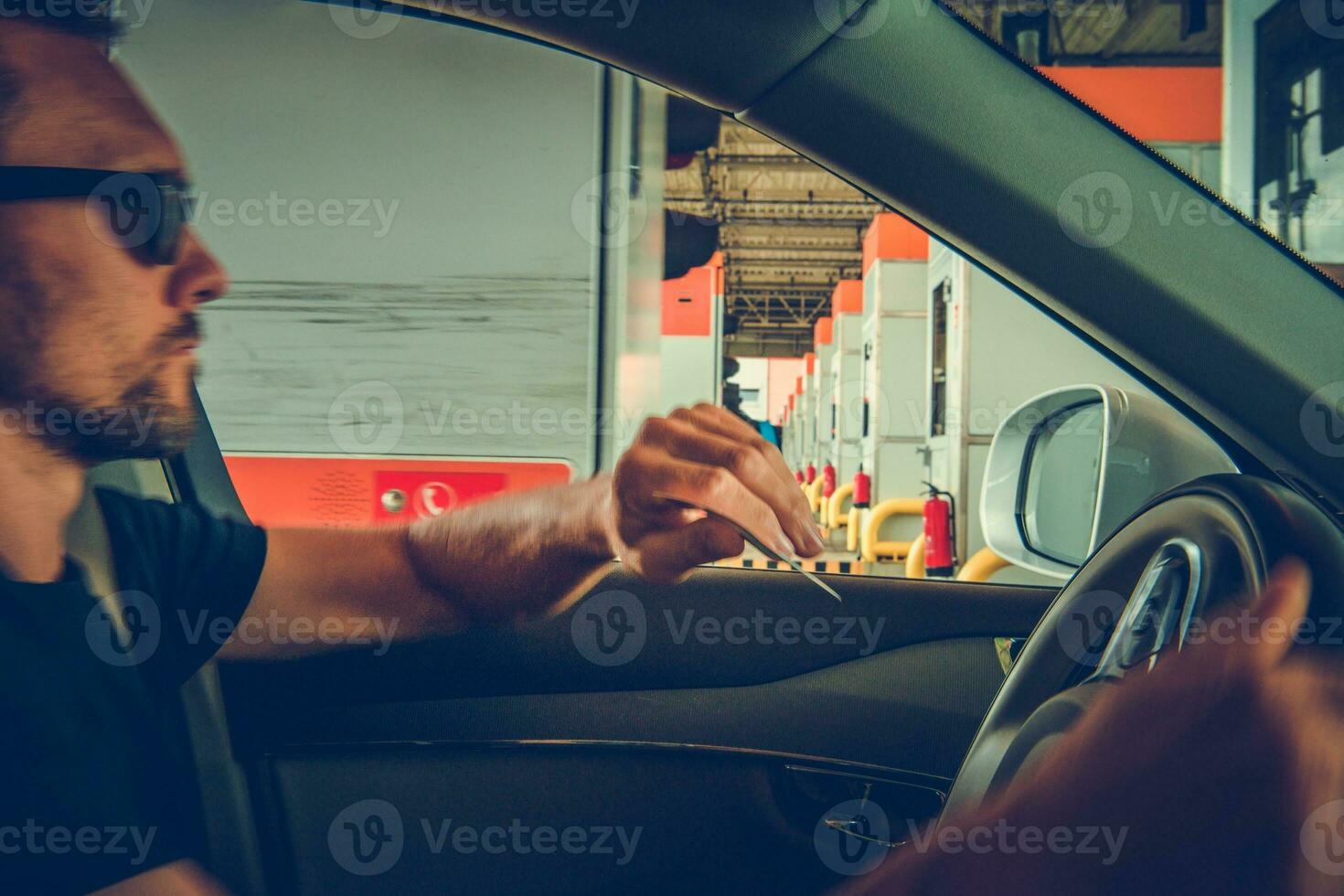 Driver Paying Highway Toll photo