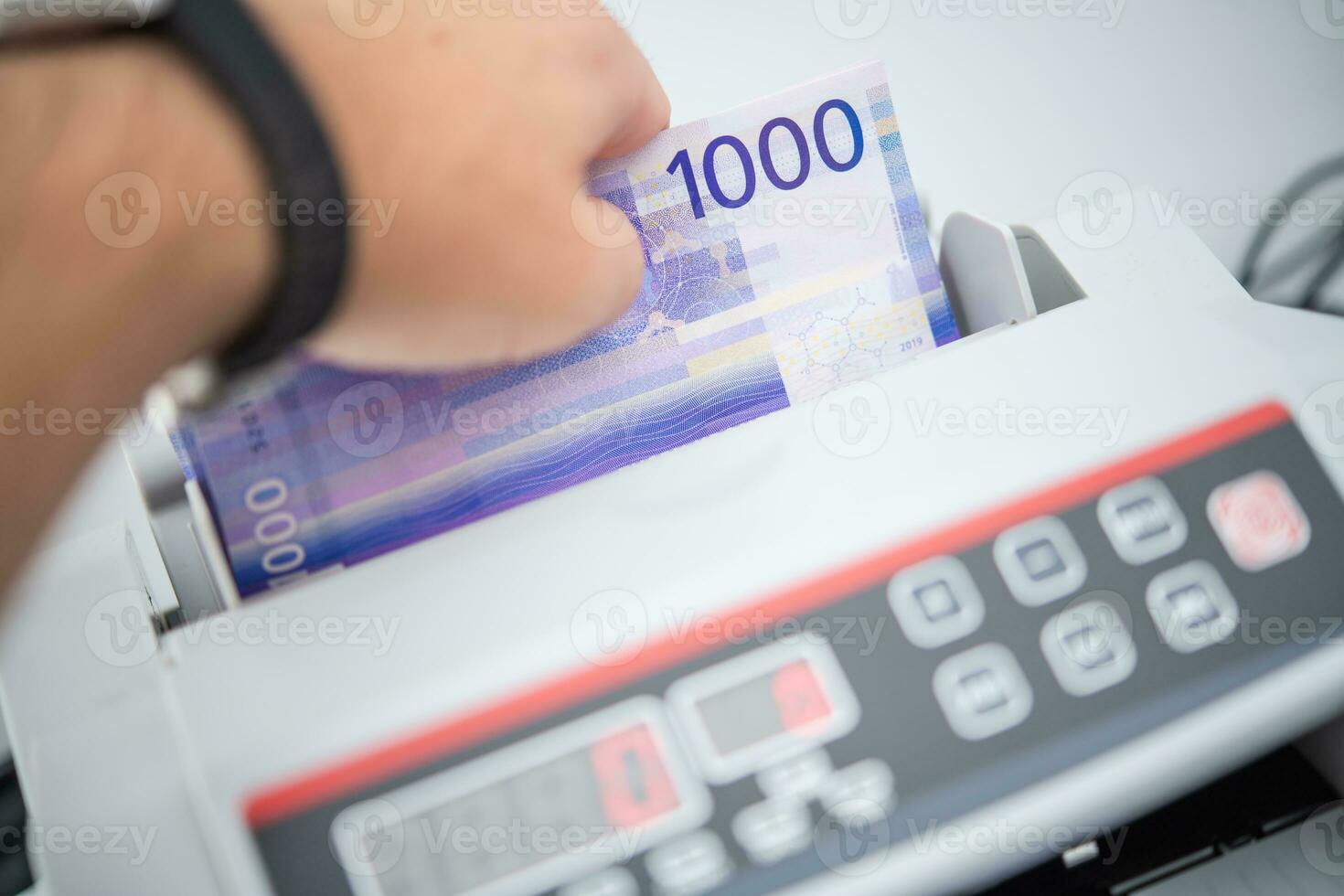 Counting cash machine photo